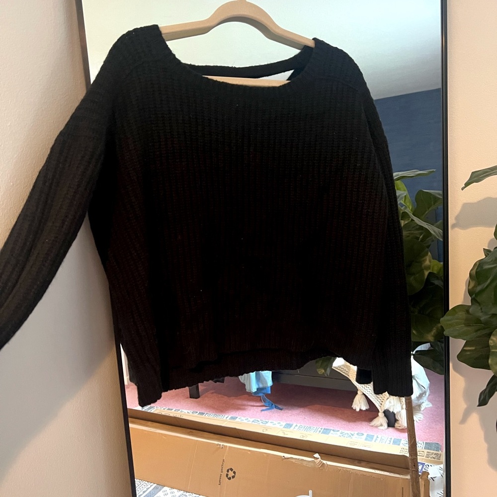 Black knit sweater with scoop back